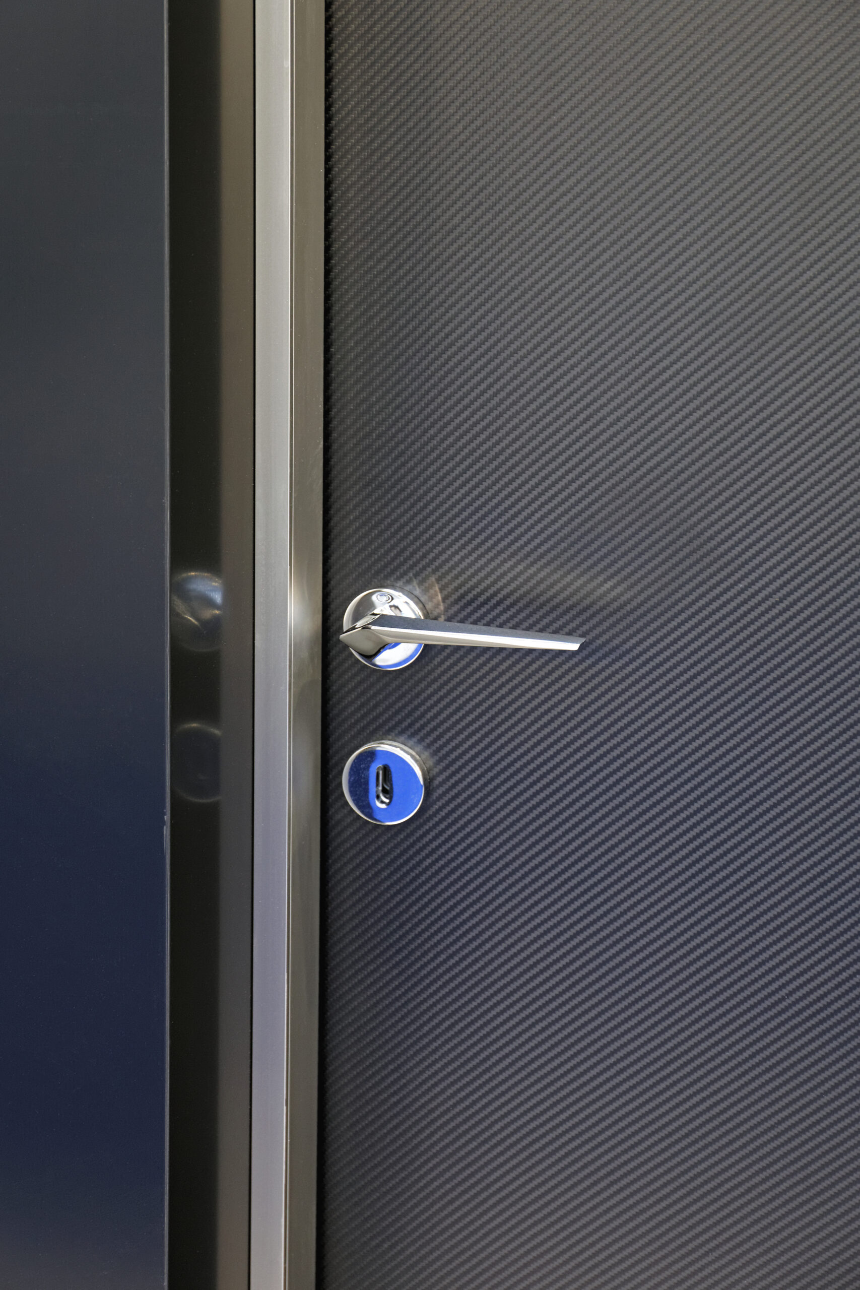 Modern gray door with metal fixtures and frame 2026 03 25 22 51 14 utc